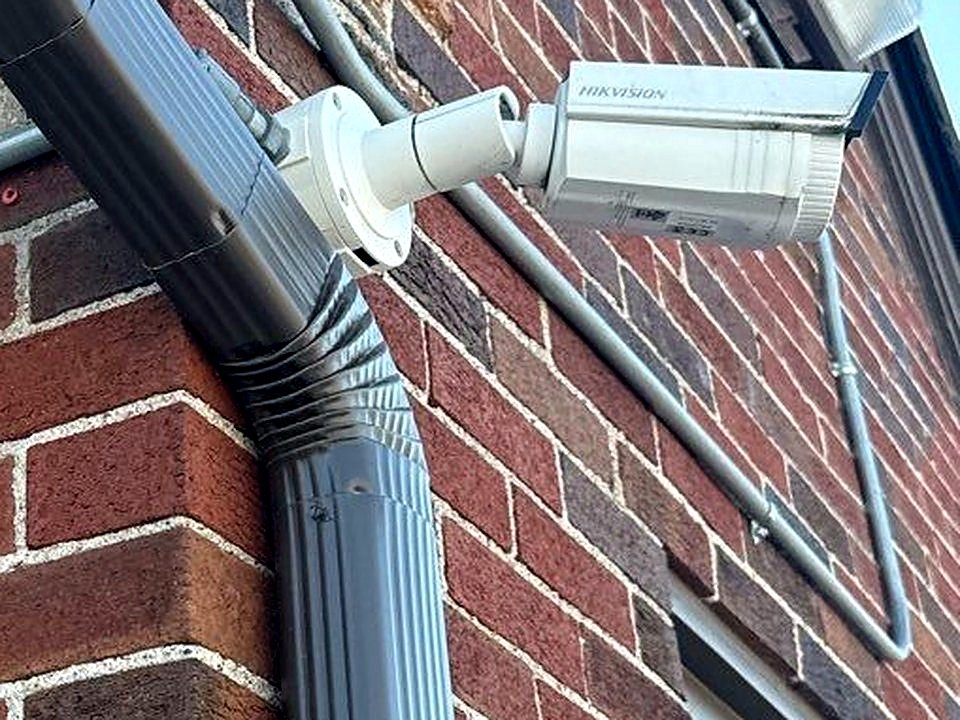 commercial bullet camera on exterior brick wall Michigan