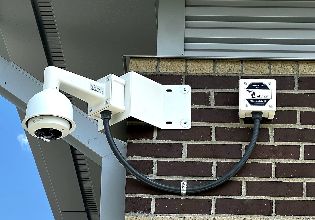 Camera with Protected By sign government facility