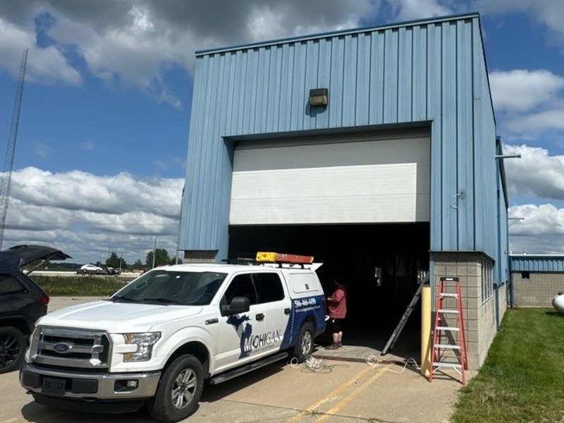 Michigan Security Systems service truck on site at a commercial building during a security camera and access control installation in Michigan