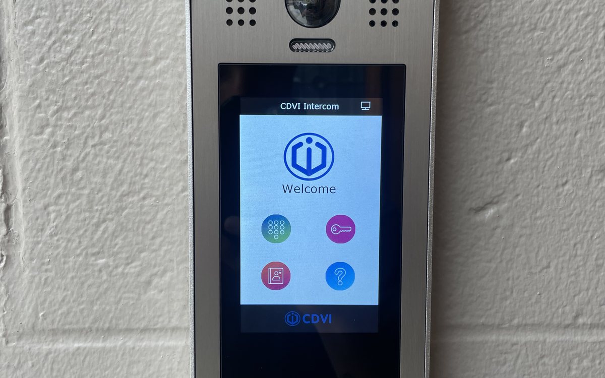 Video intercom at an apartment building entrance in Michigan, installed by Michigan Security Systems