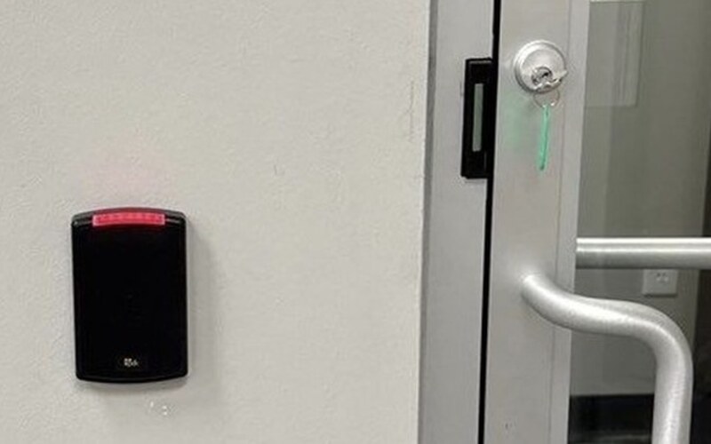 PDK proximity card reader at a commercial entry door, installed by Michigan Security Systems