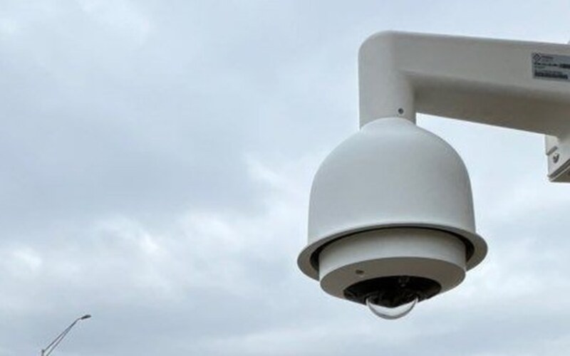 Outdoor PTZ surveillance camera providing facility-wide coverage at a Michigan distribution center, installed by Michigan Security Systems
