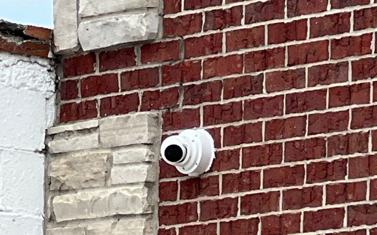Commercial security camera on a small business storefront in Michigan, installed by Michigan Security Systems
