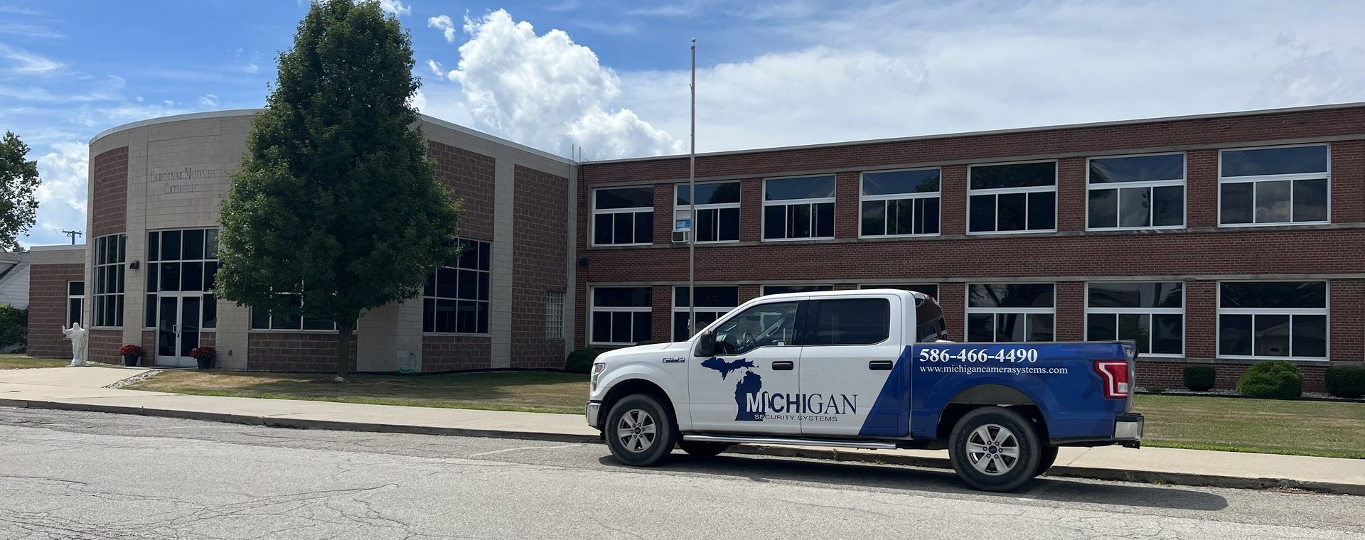 Michigan Security Systems truck at a school where vape detection systems are installed